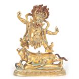 A TIBETAN JEWELLED GILT BRONZE FIGURE OF A BUDDHIST DEITY 16cm high