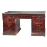 AN EARLY GEORGE III MAHOGANY PARTNERS DESK with leathered top above a bank of three frieze
