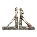 ATT. JOSEF LORENZL. A PAIR OF EARLY 20TH CENTURY SILVERED BRONZE AND MARBLE BOOKENDS modelled as a