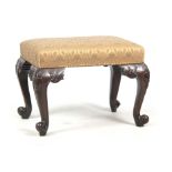 A 20TH CENTURY GEORGE III STYLE MAHOGANY STOOL with leaf carved cabriole legs and scrolled feet 60cm