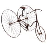 AN UNUSUAL 19TH CENTURY CHILD'S TRICYCLE having an iron frame and spoked wheels with chain drive