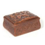 A 19TH CENTURY CARVED FRUITWOOD CONTINENTAL FOLK ART SNUFF BOX with carved figural scene to the