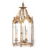 A LATE REGENCY GOTHIC STYLE HEXAGONAL GILT BRONZE HANGING LANTERN having shaped pierced arched