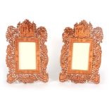 A PAIR OF 20TH CENTURY CHINESE INTRICATELY PIERCED AND CARVED WOOD PHOTOGRAPH FRAMES with dragon,