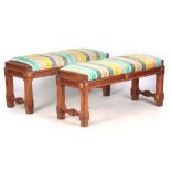 A PAIR OF EARLY 20TH CENTURY WALNUT SHIPS BENCHES with chamfered legs and roundel corners; with