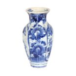 A 19th CENTURY ORIENTAL BLUE AND WHITE BULBOUS VASE OF PLEATED FORM WITH FLARED NECK decorated