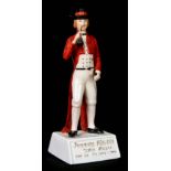 A JOHNNIE WALKER SCOTCH WHISKY ADVERTISING FIGURE on square tapering base 29.5cm high