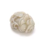 A CHINESE CARVED JADE SCULPTURE depicting a dragon with floral work decoration 5cm wide 4cm deep.