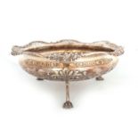 A LARGE GEORGE V QUALITY PIERCED SILVER FRUIT BOWL with cast flower spray and C scroll border