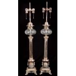 A STYLISH PAIR OF 19TH CENTURY SILVER PLATED ELECTRIFIED OIL LAMPS with Corinthian column stems