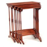 A NEST OF FOUR EARLY 20TH CENTURY SATINWOOD AND MAHOGANY INLAID OCCASIONAL TABLES the rectangular