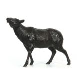A JAPANESE MEIJI PERIOD PATINATED BRONZE SCULPTURE modelled as a walking sheep, signature to
