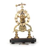 A 19TH CENTURY BRASS SKELETON CLOCK with eight-day fusee timepiece movement, scalloped silvered dial