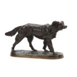A LATE 19TH CENTURY PATINATED BRONZE SCULPTURE modelled as a standing gun dog on naturalistic base