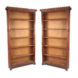 A PAIR OF 19TH CENTURY GOTHIC OAK OPEN BOOKCASES IN THE MANER OF PUGIN with linen fold panelled