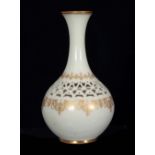 GEORGE OWEN A ROYAL WORCESTER BULBOUS CABINET VASE with slender flared neck, reticulated shoulder