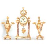 A LATE 19TH CENTURY FRENCH ORMOLU AND VEINED MARBLE CLOCK GARNITURE the case with torch finial above
