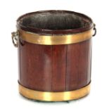 AN UNUSUAL SMALL GEORGE III MAHOGANY OYSTER BUCKET of brass-bound coopered form, fitted axe-drop