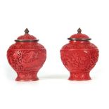 A LATE 19TH CENTURY CHINESE CINNABAR LIDDED BULBOUS VASE with floral carved decoration and