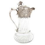 A LATE VICTORIAN SILVER MOUNTED CLARET JUG the swirled glass body and ornate silver mount