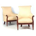 A PAIR OF LATE REGENCY MAHOGANY UPHOLSTERED LIBRARY CHAIRS IN THE MANNER OF GILLOWS with shaped