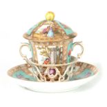 AN UNUSUAL 19TH CENTURY DRESDEN TWO-HANDLED CHOCOLATE CUP AND COVER ON STAND with pierced holder,