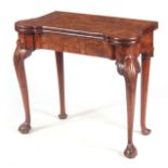 An EARLY 18TH CENTURY FIGURED WALNUT CARD TABLE the hinged crossbanded top revealing a beige