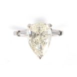 A PLATINUM PEAR SHAPE SOLITAIRE DIAMOND RING the shallow cut diamond weight app. 2.3cts but