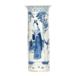 AN 18th CENTURY CHINESE CYLINDRICAL BLUE AND WHITE VASE having a flared neck with figural panels and