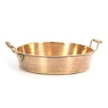 A 19TH CENTURY CAST BELL METAL SHALLOW CREAM PAN with raised rivetted side handles 40cm diam