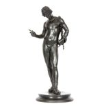 A 19TH CENTURY PATINATED BRONZE SCULPTURE modelled as "Narciso, after the Antique" by Vincenzo