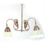 A LATE 19TH CENTURY ART NOUVEAU STYLE BRASS HANGING LIGHT FITTING fitted with two large Vaseline and