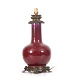 A 19th CENTURY CHINESE FLAMBE-GLAZED BOTTLE VASE LAMP with Rococo style brass mounts 50cm high.