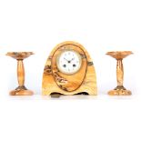 A FRENCH ART DECO SIENNA MARBLE CLOCK GARNITURE the arched case with brass beaded decoration