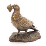 A LATE 19TH CENTURY AUSTRIAN BRONZE INKWELL modelled as a carrier pigeon holding an envelope in