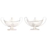 A FINE PAIR OF GEORGE III SILVER SAUCE TUREENS the oval bodies with reed edged rims on matching