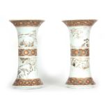 A PAIR OF 19TH CENTURY JAPANESE VASES OF CIRCULAR FORM WITH FLARED NECKS AND RINGED BODIES