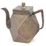 A MEIJI PERIOD JAPANESE BRONZE TEAPOT of faceted form with shallow raised decoration depicting