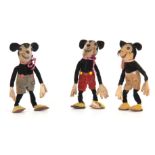 WALT DISNEY. A COLLECTION OF THREE MICKEY MOUSE FELT DOLLS printed registration number to necks,