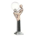 AN ART DECO SILVERED FIGURAL LAMP WITH CRACKLE GLASS SHADE formed as a semi-nude dancer sat on a
