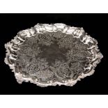 A LARGE 19TH CENTURY ROCOCO STYLE SILVER PLATED SALVER with shell and C scroll deep scalloped border