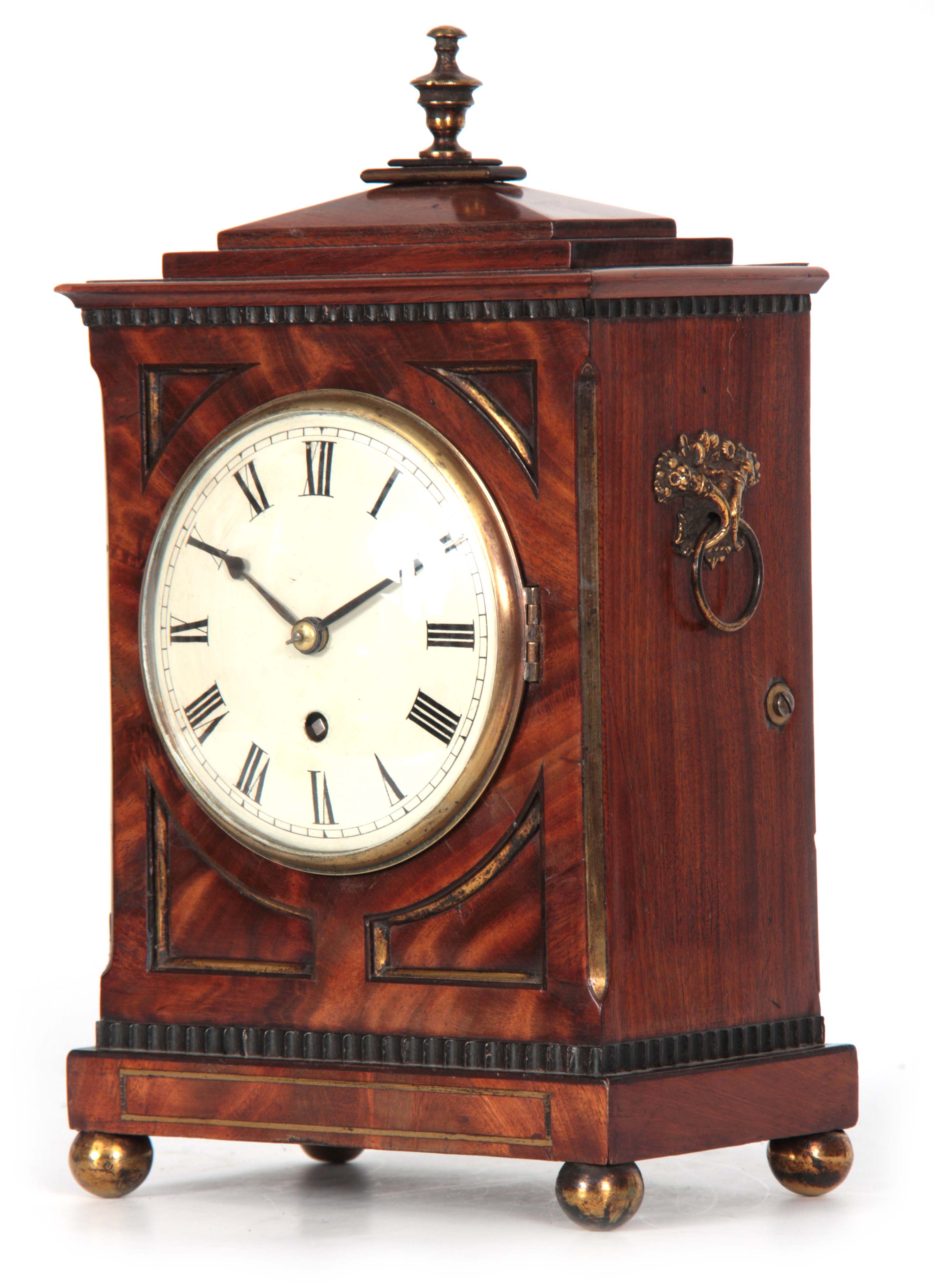 A GOOD REGENCY MAHOGANY STEPPED CHAMFER TOP AND BRASS MOUNTED BRACKET CLOCK OF SMALL SIZE with brass