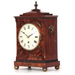 A GOOD REGENCY MAHOGANY STEPPED CHAMFER TOP AND BRASS MOUNTED BRACKET CLOCK OF SMALL SIZE with brass