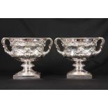 A FINE PAIR OF ELIZABETH II SILVER WARWICK VASES of circular form with well-cast decoration