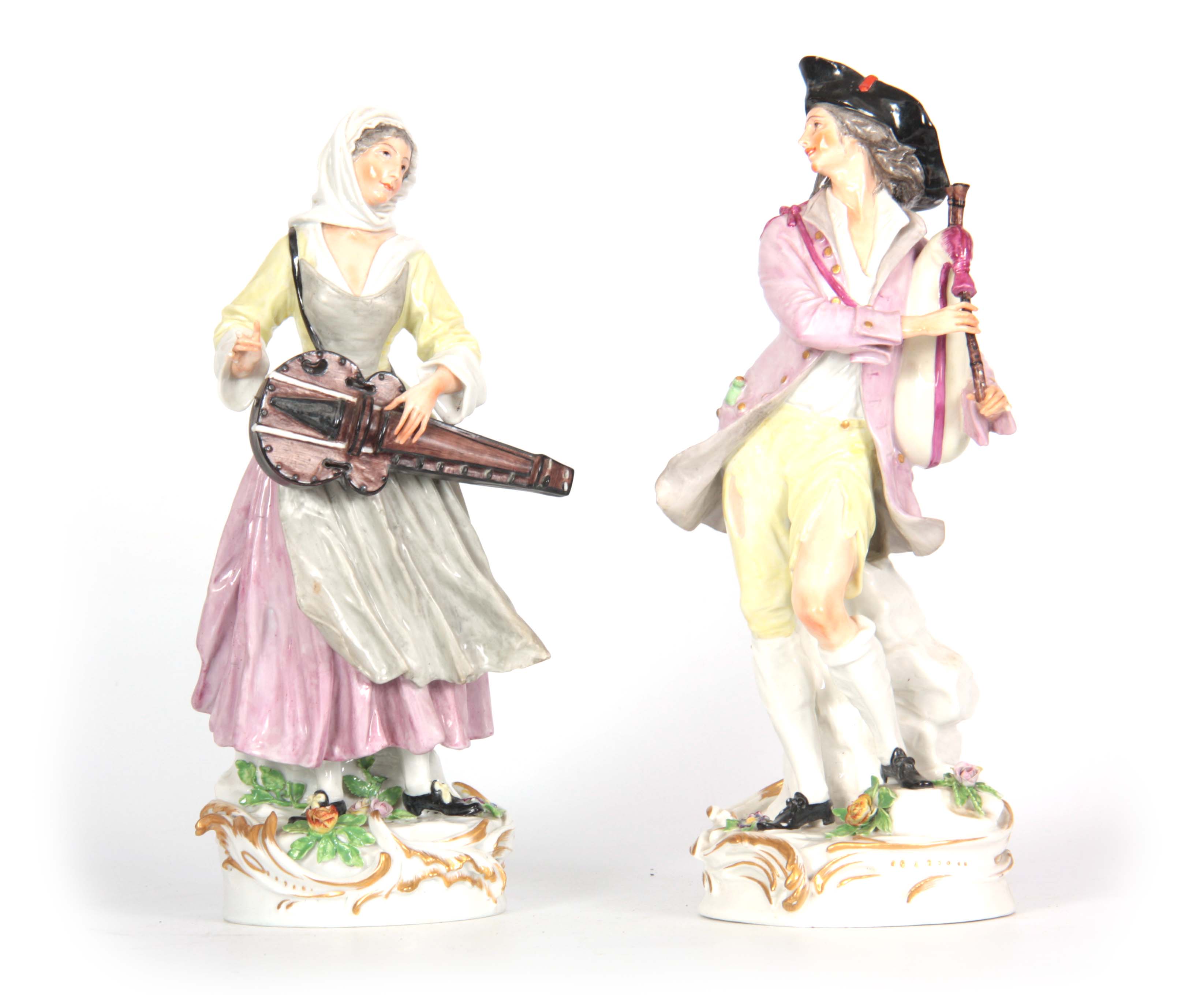 A PAIR OF LATE 19th CENTURY CONTINENTAL PORCELAIN FIGURES IN THE MEISSEN STYLE of two musicians in