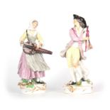 A PAIR OF LATE 19th CENTURY CONTINENTAL PORCELAIN FIGURES IN THE MEISSEN STYLE of two musicians in