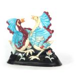 AN UNUSUAL MODERN MOORCROFT SCULPTURE OF TWO BIRDS FIGHTING mounted on a moulded base - signed M