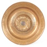 A 17TH/18TH CENTURY CONTINENTAL BRASS ALMS DISH with punched border enclosing a deep centre with