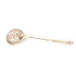 A LATE 19TH CENTURY RUSSIAN SILVER AND SILVER GILT SPOON having a rope twist handle and foliate