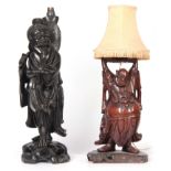 TWO 19TH CENTURY CHINESE CARVED HARDWOOD STANDING FIGURAL TABLE LAMPS 54cm high and 40cm high